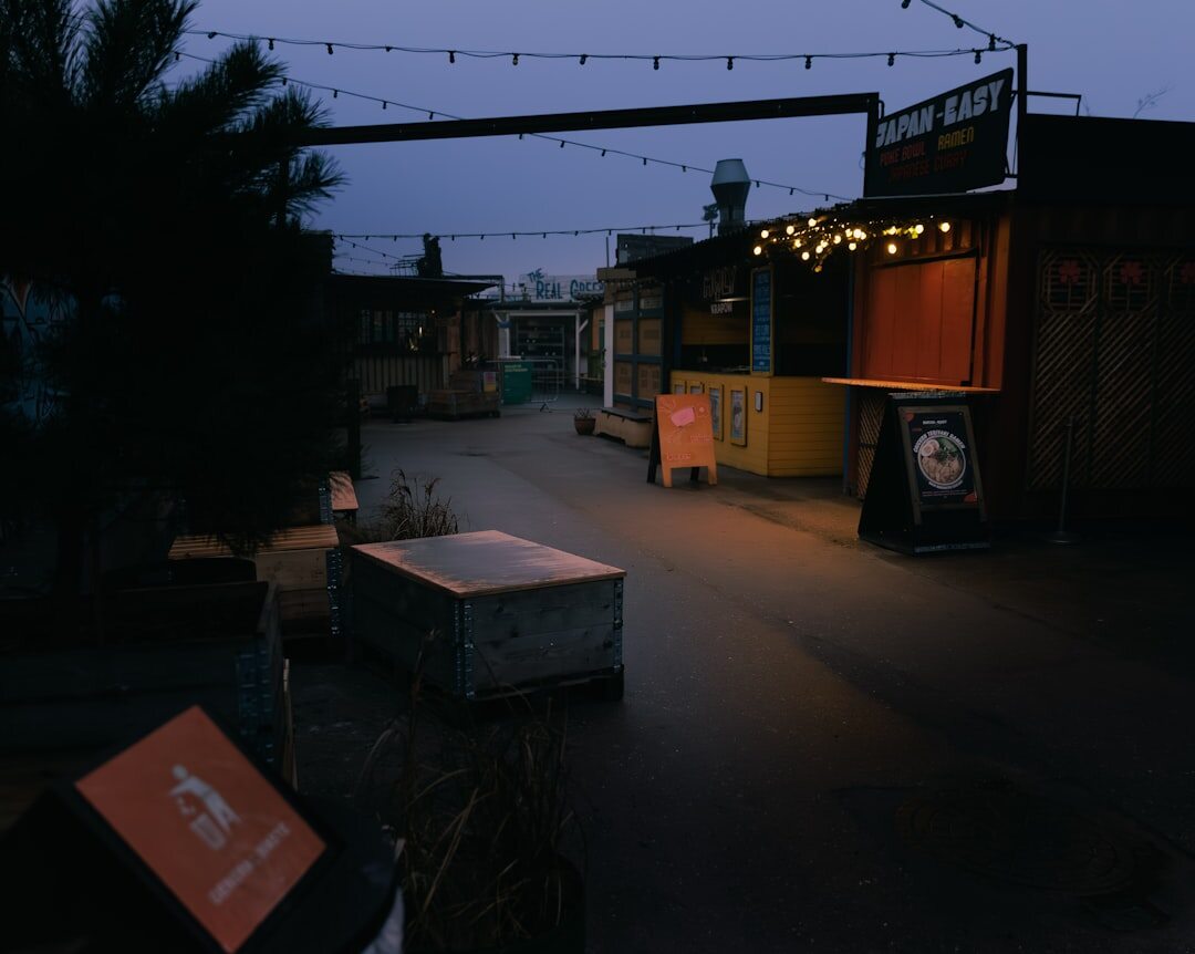 Small outdoor market stalls with fresh produce in a Danish town square