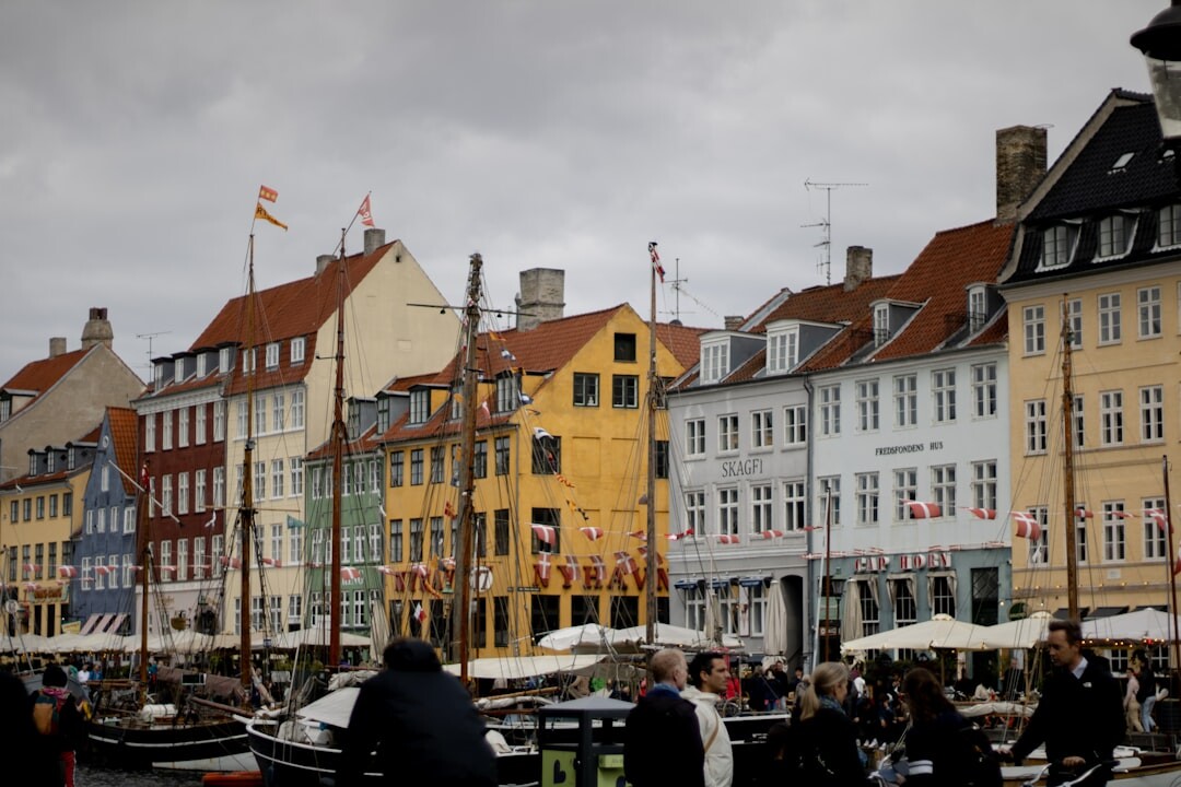 Group of Danish fishermen mending fishing nets at the harbor