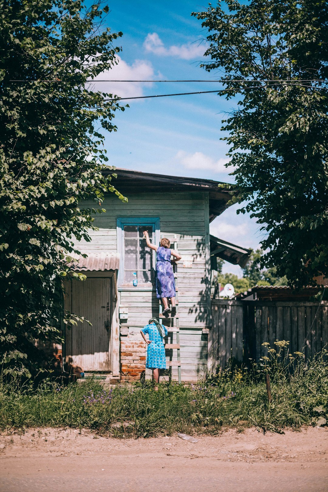 young mother with child in village
